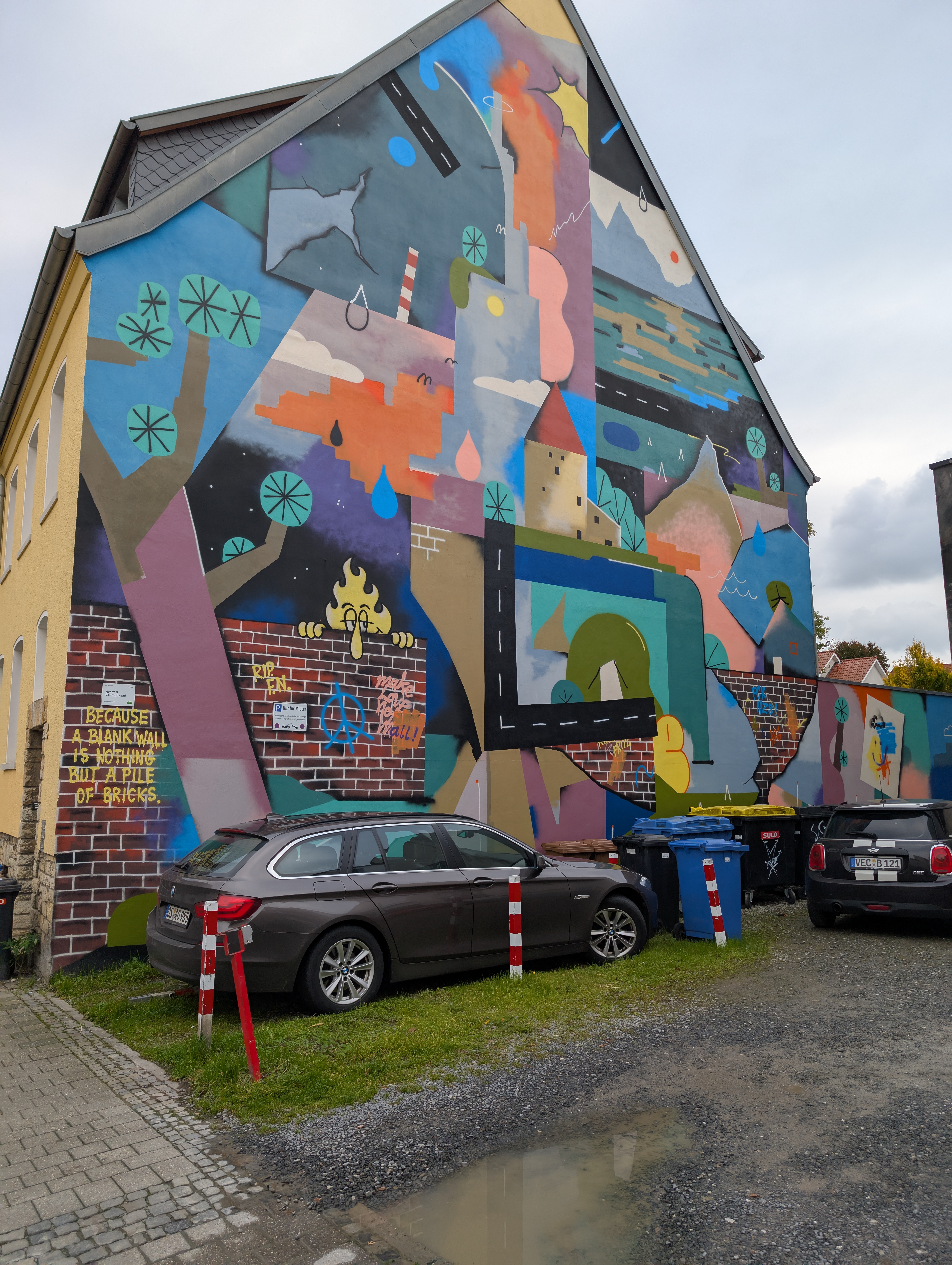 Very colorful graffiti on the side of a building